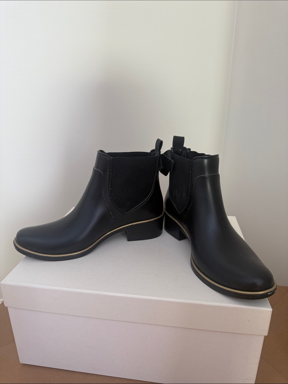 kate spade Black Chelsea Ankle Rain Boots with Gold Accent